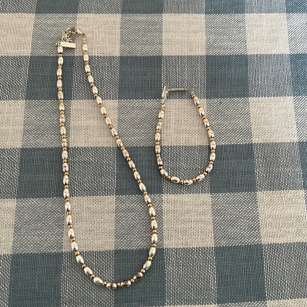 Silver and gold colors necklace and bracelet set.